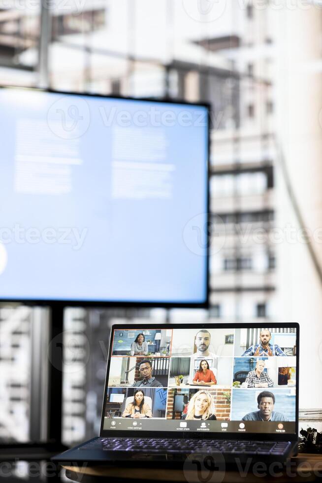 Focus on laptop showing board of directors holding teleconference meeting with job candidate, asking questions and presenting company. Close up of HR employees conducting interviews during call photo