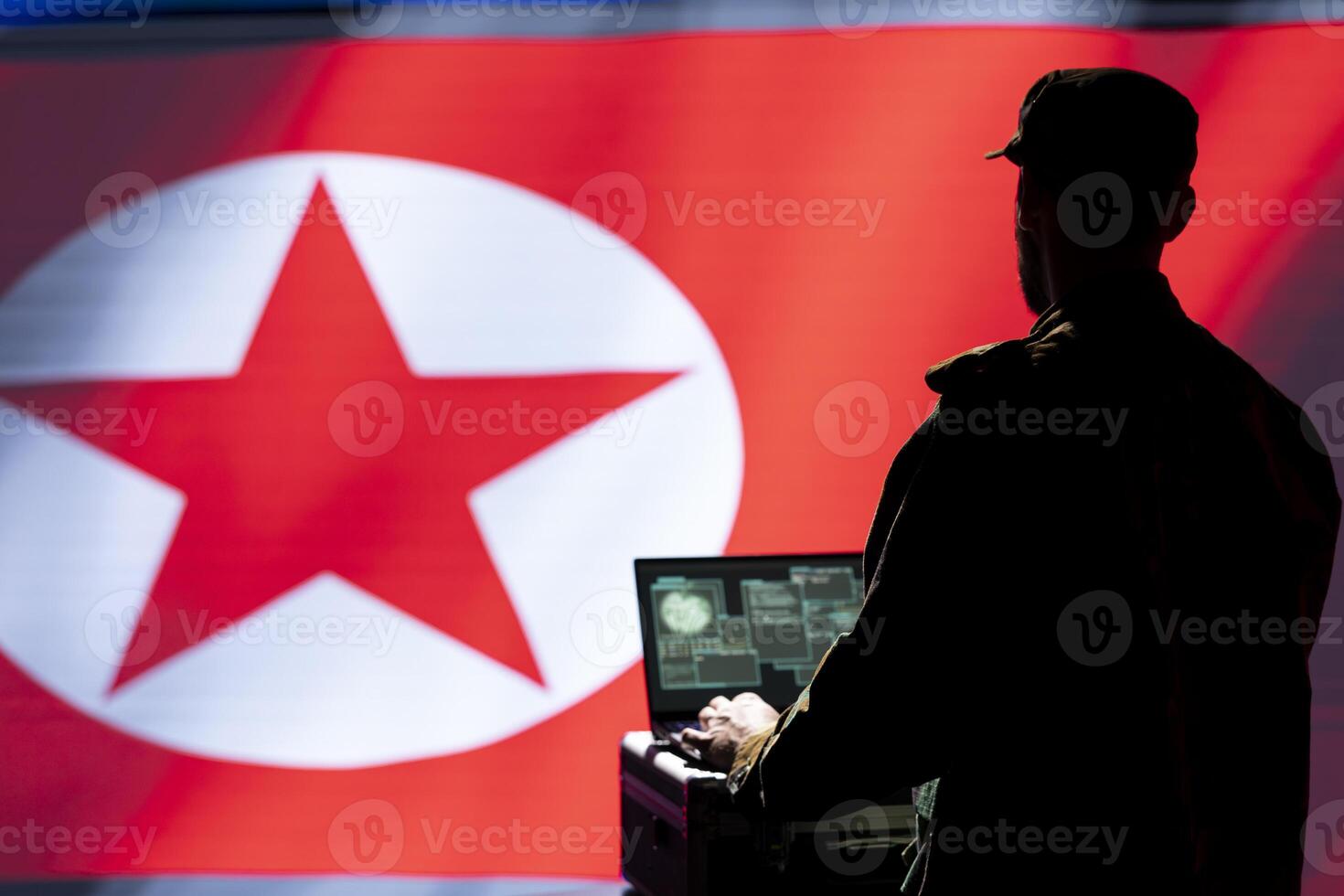 Intelligence officer isolated over North Korea flag monitoring zone of interest using radar. Pyongyang regime operative engaged in surveillance mission using laptop, looking at world map photo
