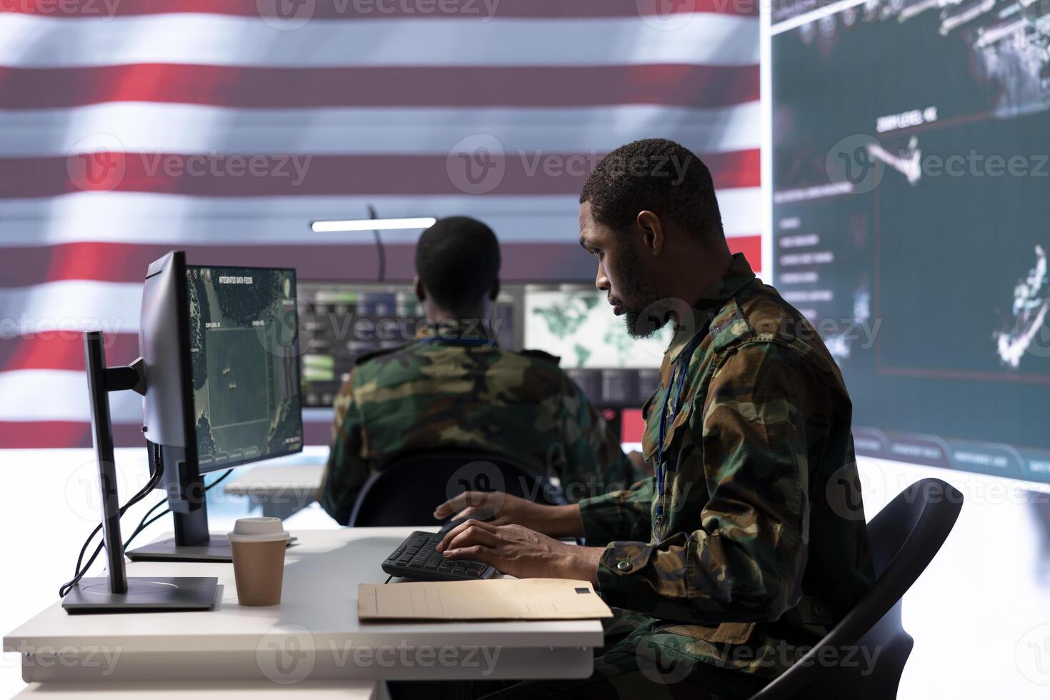 Team of military personnel manages surveillance and security operations from a high tech command center, ensuring data protection and national security with surveillance imagery. photo