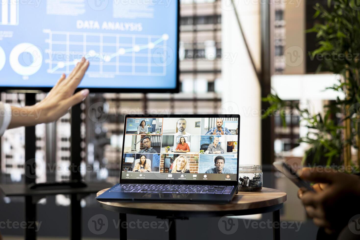 Interviewer greeting job candidates, using laptop to do teleconference meeting, asking questions and presenting company. Manager saluting people during online videocall interview photo