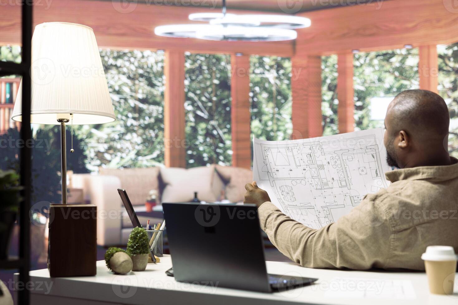 Businessman evaluating architectural sketches and planning an office renovation, focusing on workspace design and strategic planning. Studies interior design ideas for workspace relocation. photo