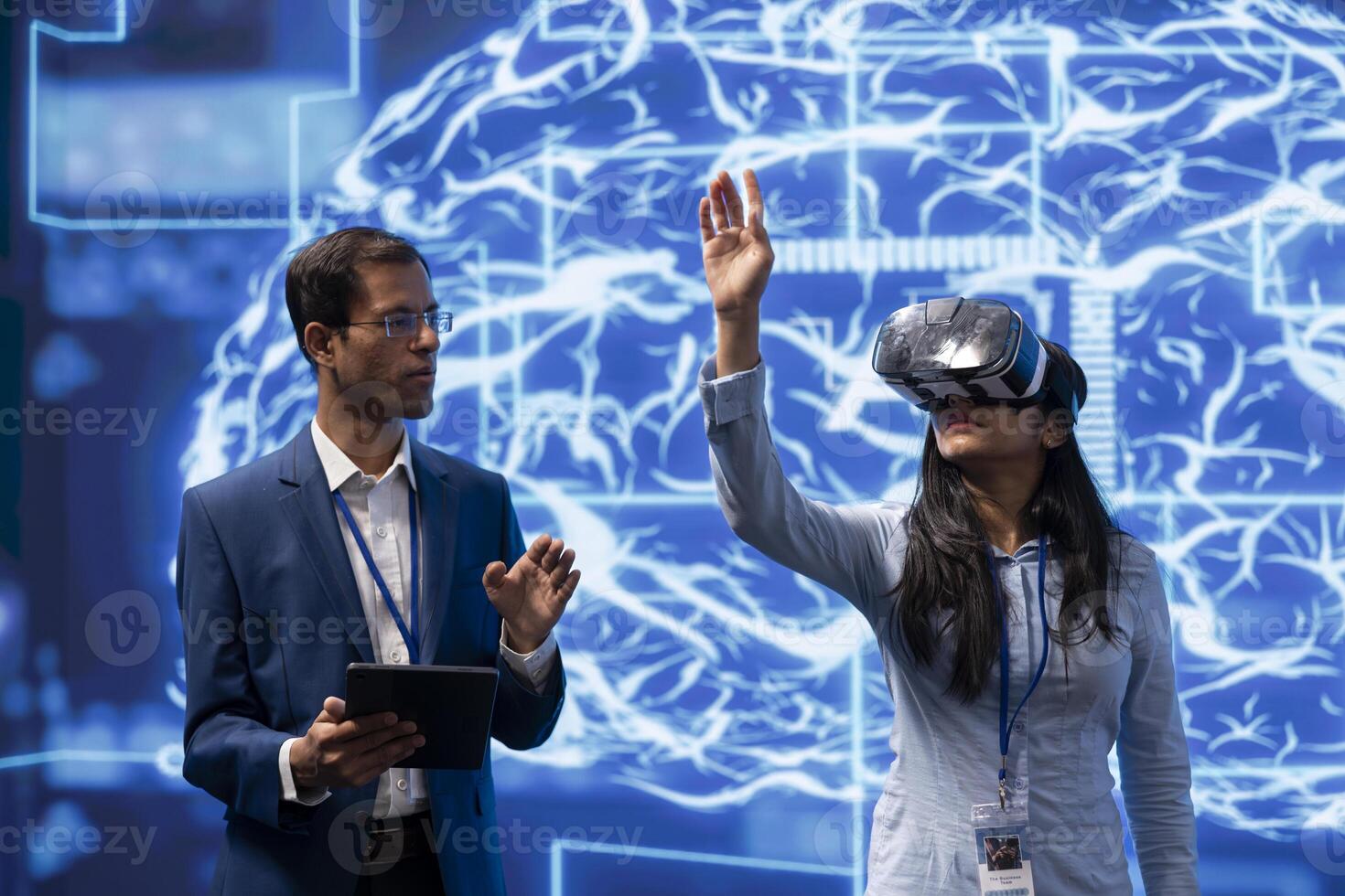 Specialist doing VR headset demonstration at AI tech conference gathering experts seeking to discover latest innovations. Engineer presents how virtual reality can be leveraged to improve businesses photo