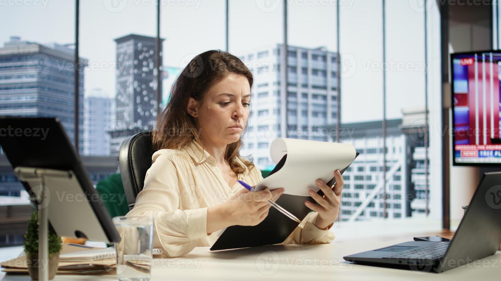 Corporate leader signing work contracts and agreements to approve leave requests and other documents for productivity. CEO businesswoman working on legal management, success story. Camera B. photo