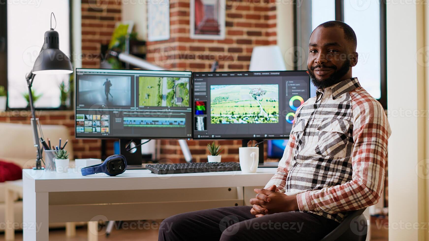 Male filmmaker editing montage on professional software, doing freelance work for a cinematic project using dual monitors. Young man working on a creative process at home. Camera B. photo