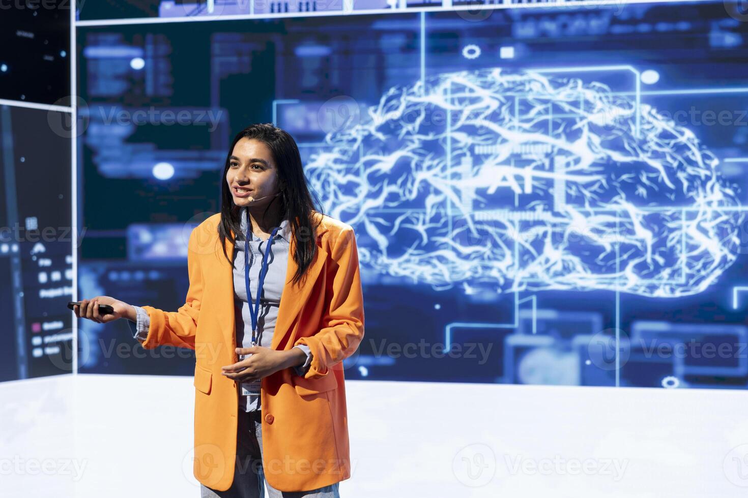 Smiling specialist talking at global conference, exploring subjects such as enterprise AI, machine learning, security, ethical AI, deep learning, data ecosystems and natural language processing photo