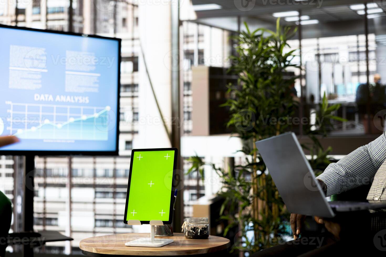 Green screen tablet next to manager in office implementing business strategies to improve operational efficiency and profitability. Chroma key device next to company supervisor setting revenue targets photo
