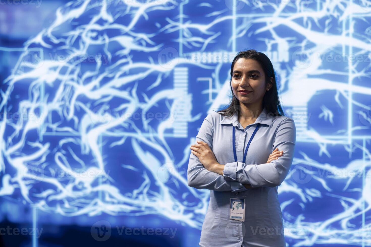 Portrait of cheerful admin using artificial intelligence computing simulating human brain. Smiling programmer working with AI machine learning algorithms in modern workspace photo