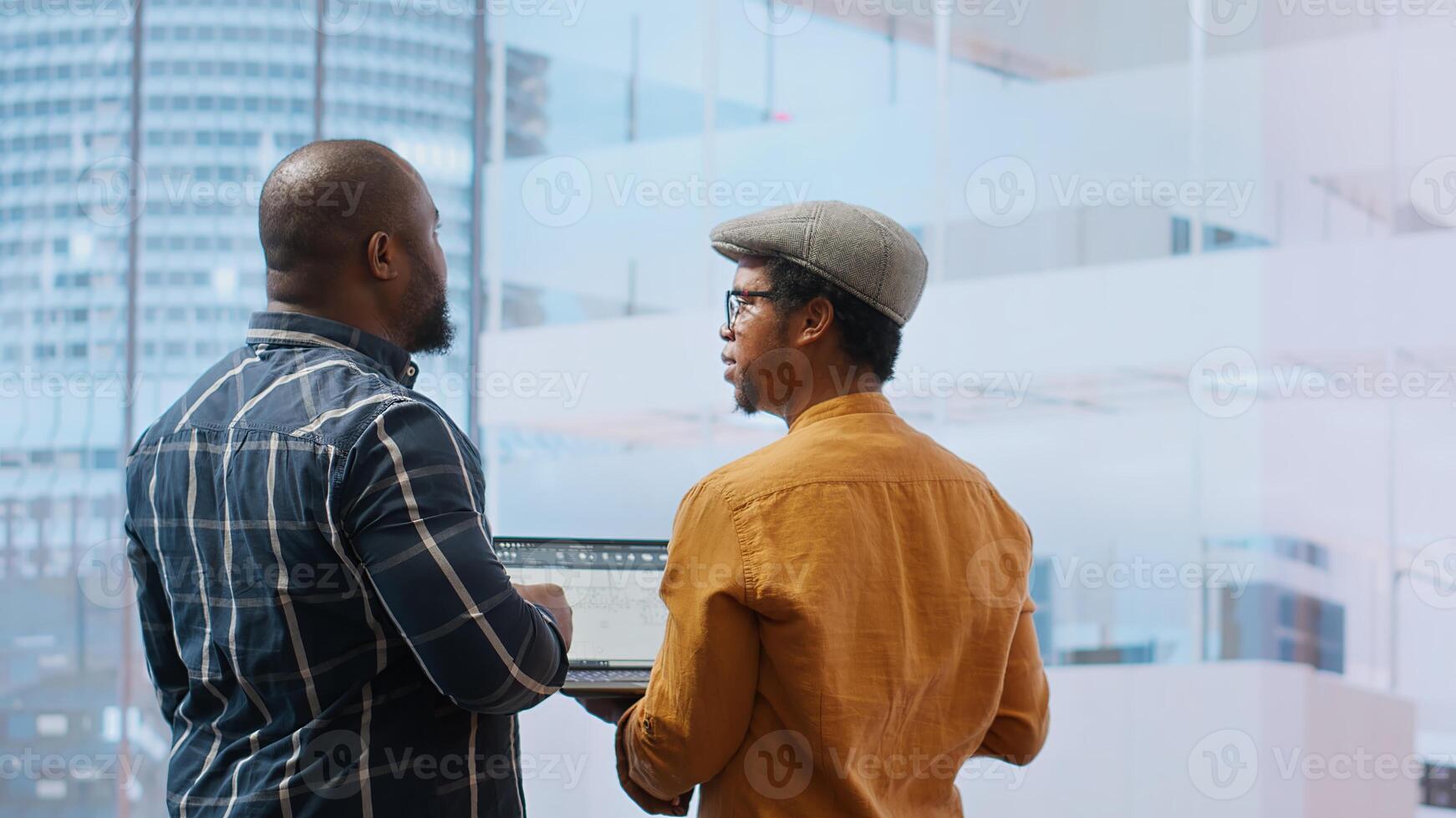 Real estate team and businesswoman discussing workspace design and planning, reviewing layout blueprints during an office tour. Investing in property leasing for startup development. Camera B. photo