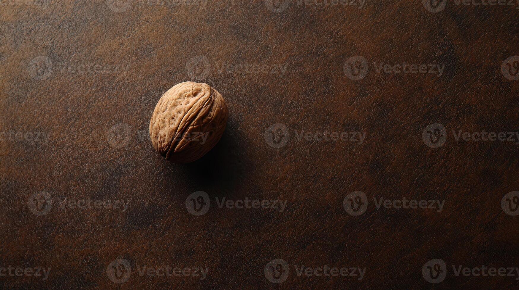 A walnut on a brown surface photo