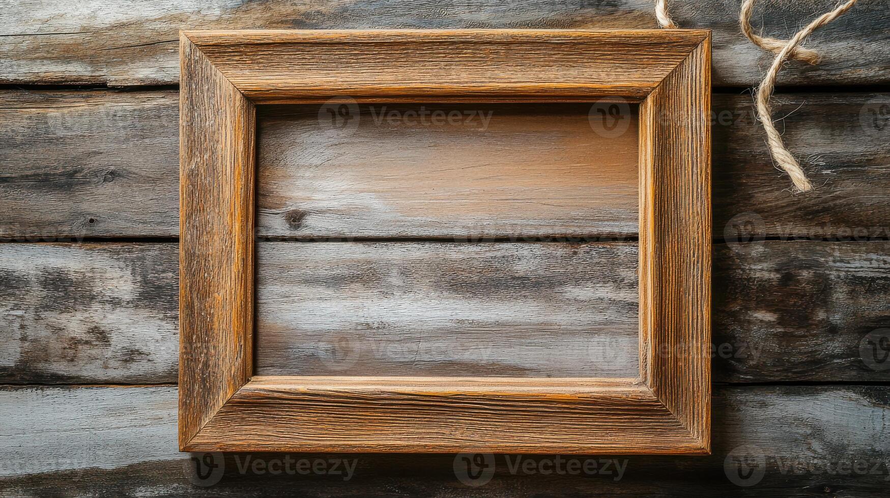 A wooden frame on a wall with a rope photo