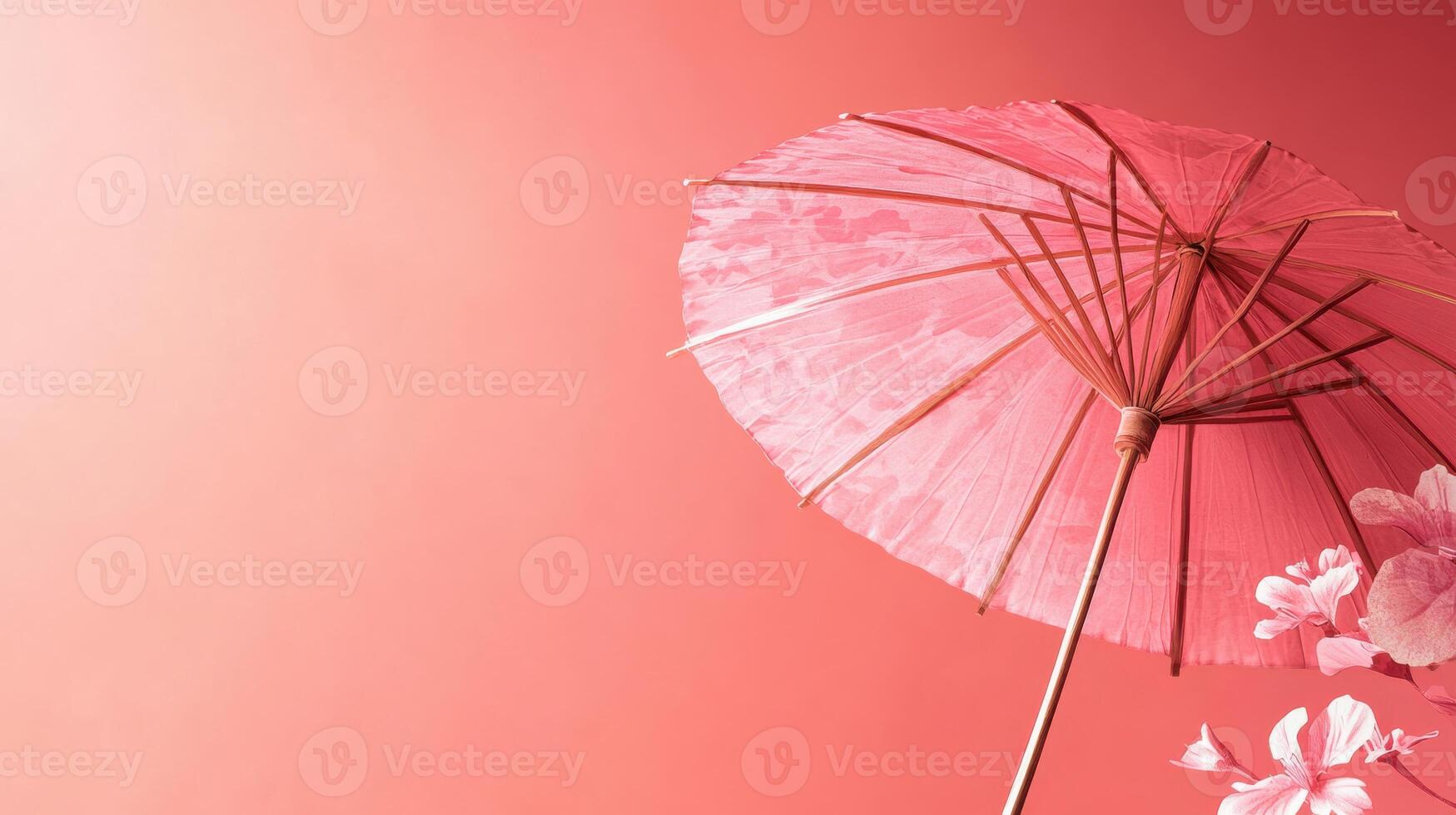 Pink parasol against a vibrant backdrop with floral accents showcasing elegance and charm in a creative display photo