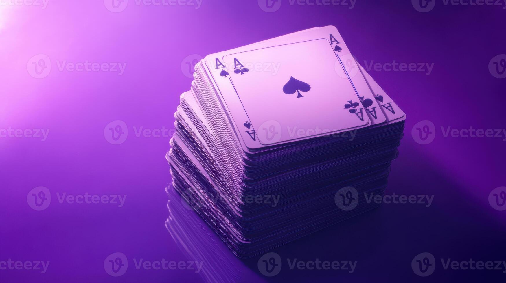 A stack of playing cards on a purple background photo
