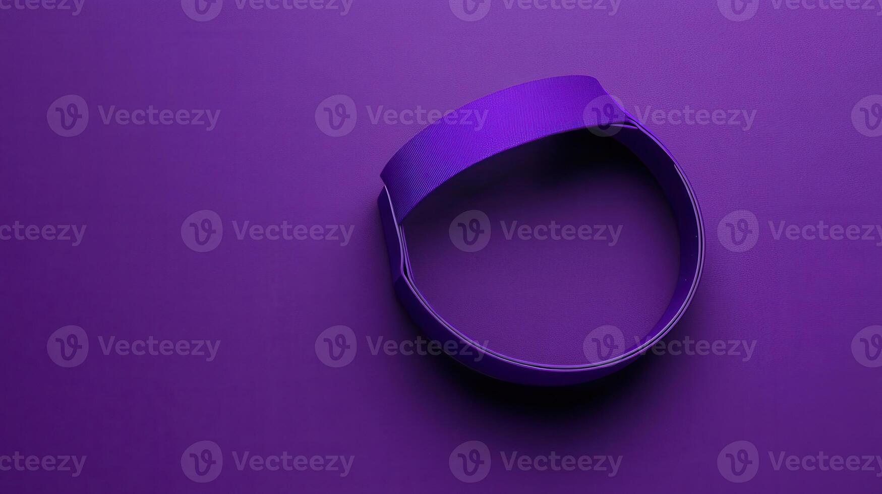 A purple ribbon is sitting on a purple surface photo