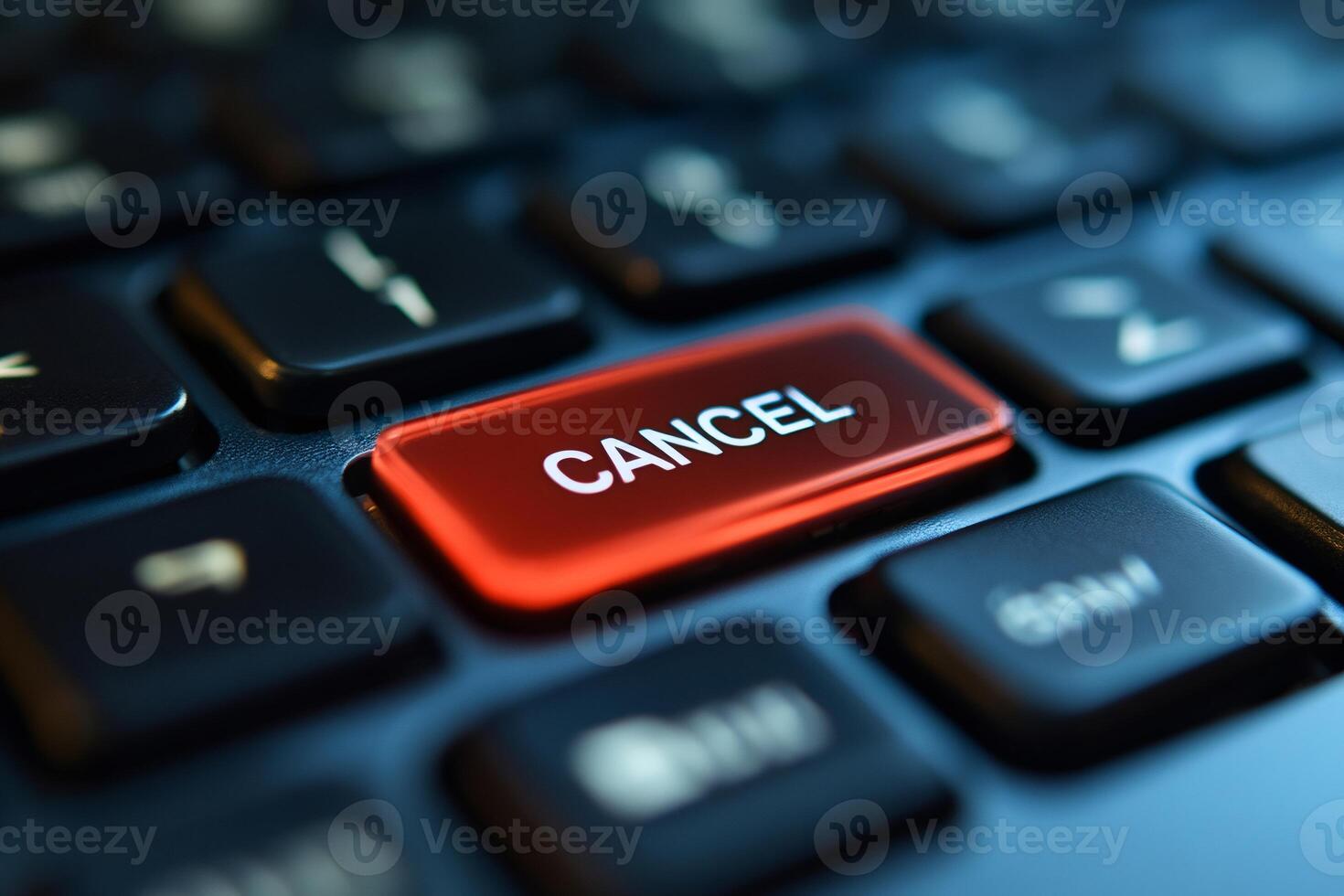 Red cancel key glowing on black keyboard photo