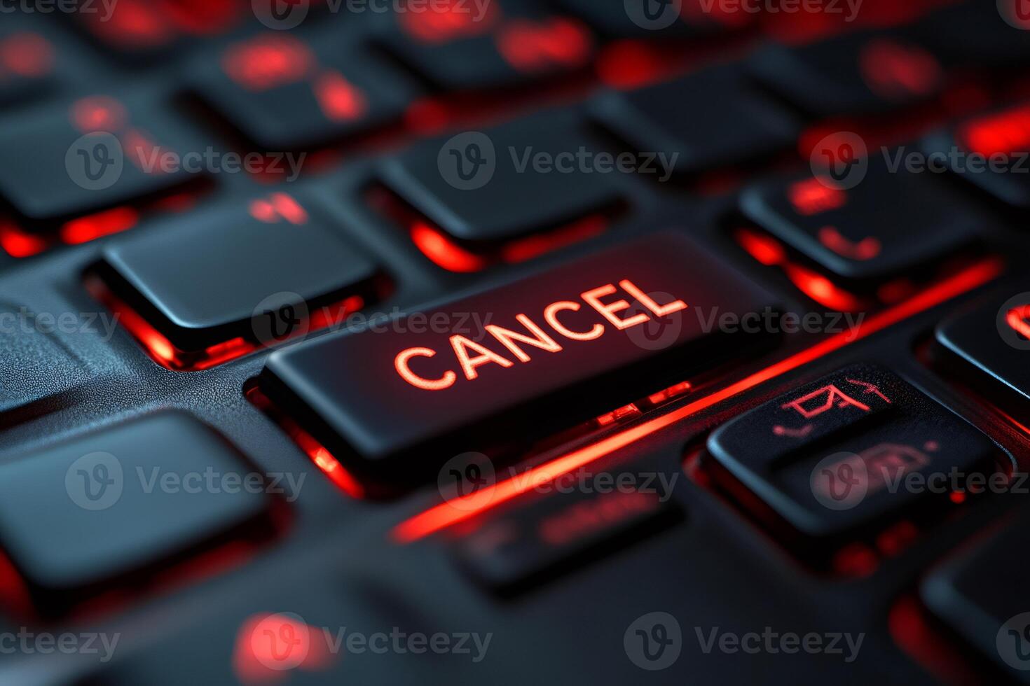 Cancel key glowing red on black keyboard closeup. photo