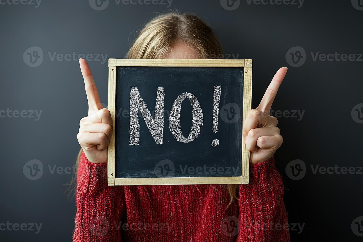 Woman hiding face showing no sign and pointing up with fingers photo