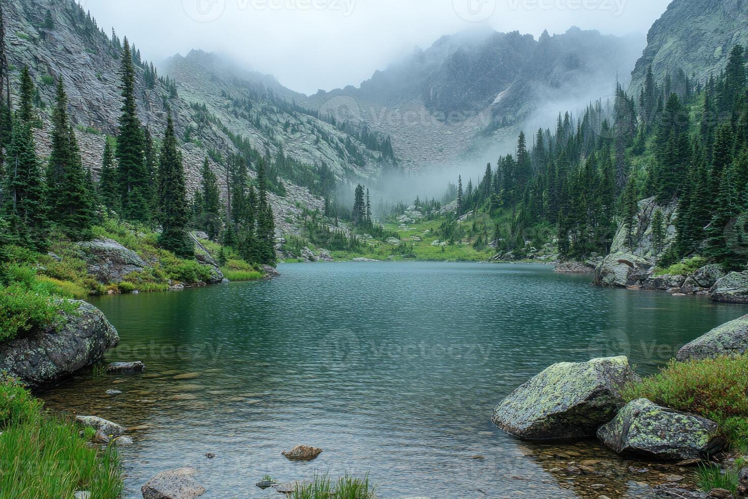 Fog hanging over lake isabelle in the indian peaks wilderness photo
