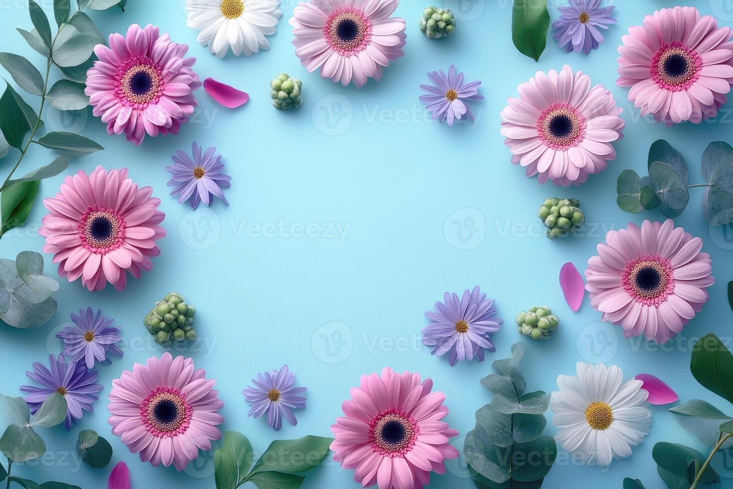 Floral frame composition creating copy space on light blue background photo