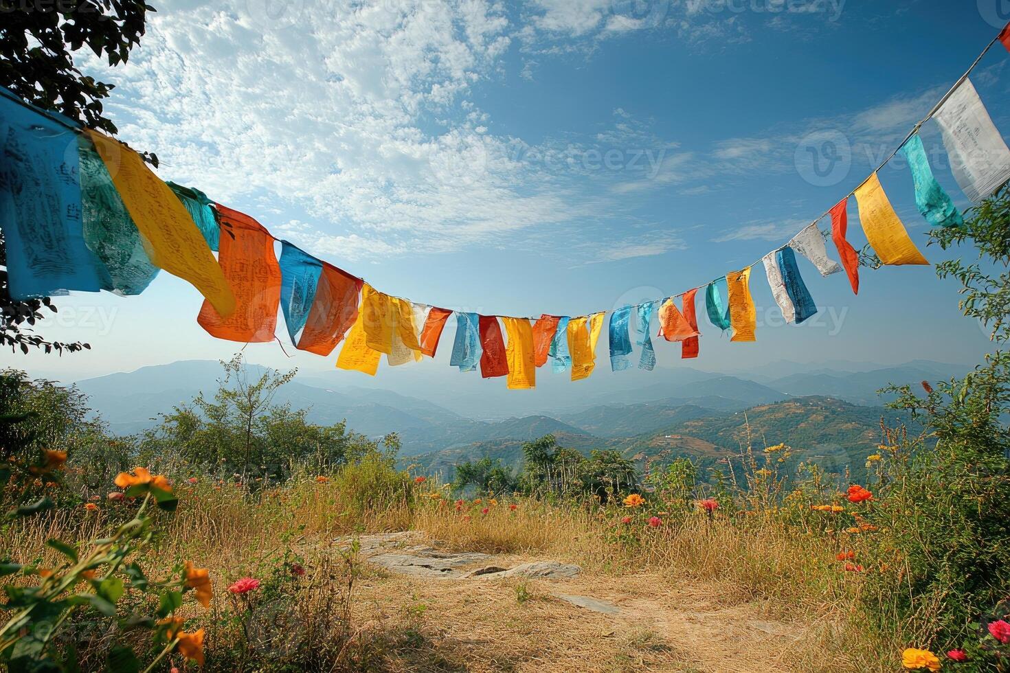 Colorful prayer flags hanging over scenic mountain view photo