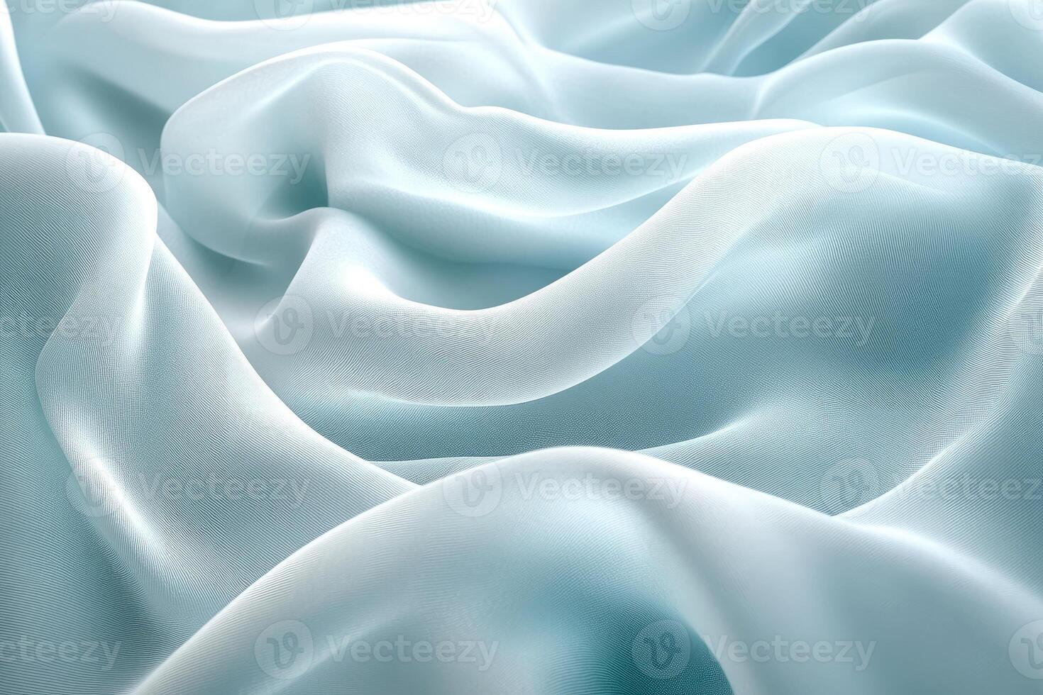 Light blue silk fabric flowing and forming elegant curves photo