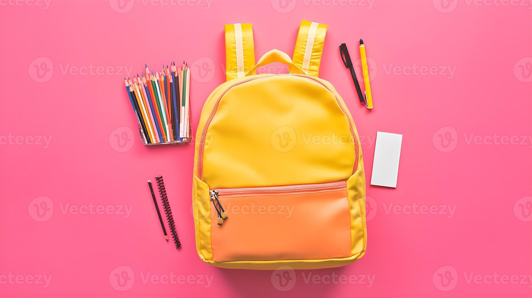 Bright Yellow Backpack with School Supplies on Pink Background photo