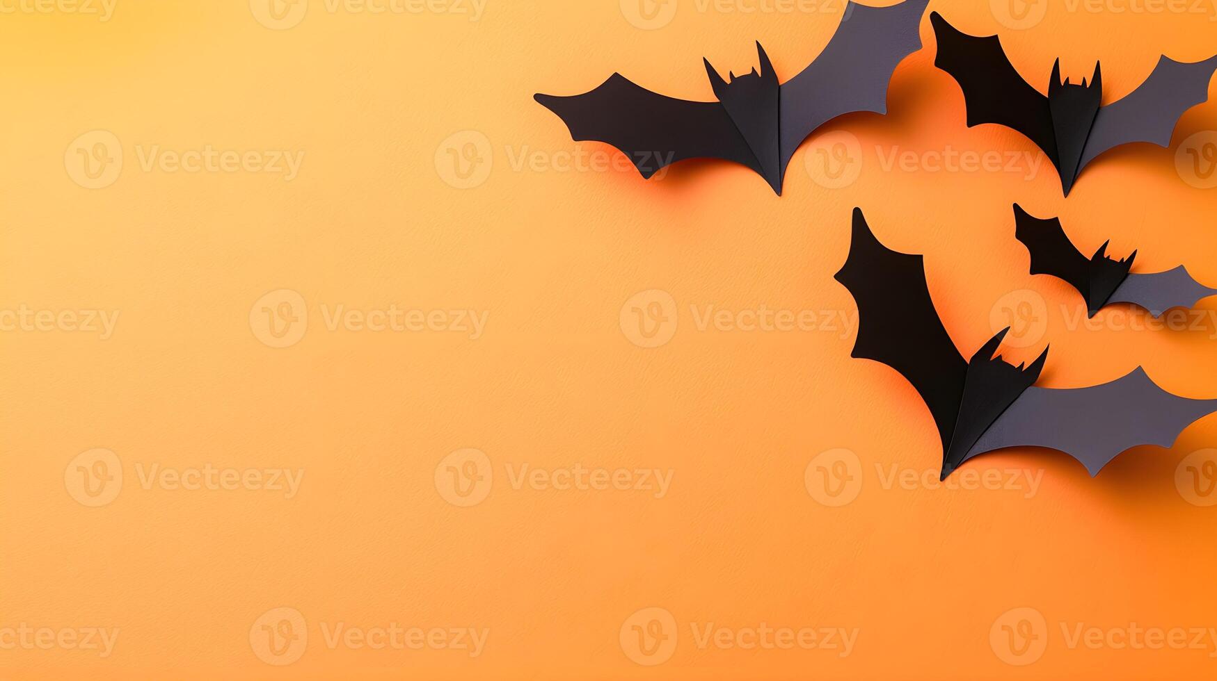 Black Paper Bats on Orange Background for Halloween Decor Ideas photo