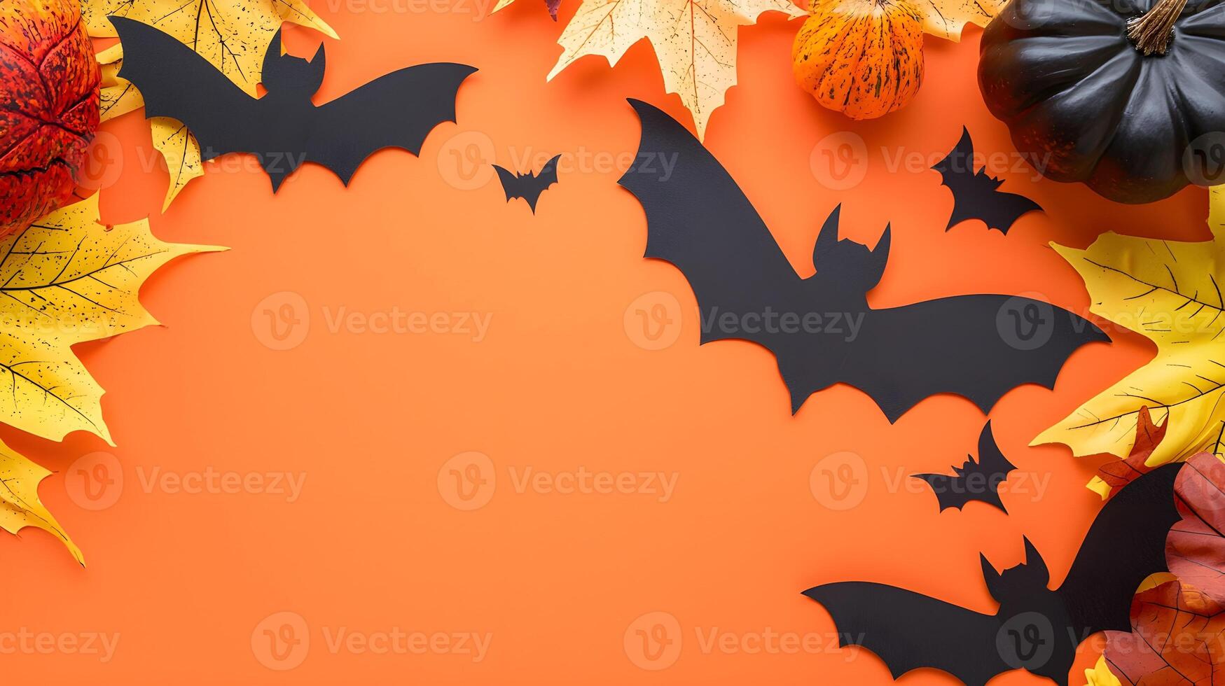 Halloween Decoration with Bats, Pumpkins, and Autumn Leaves photo