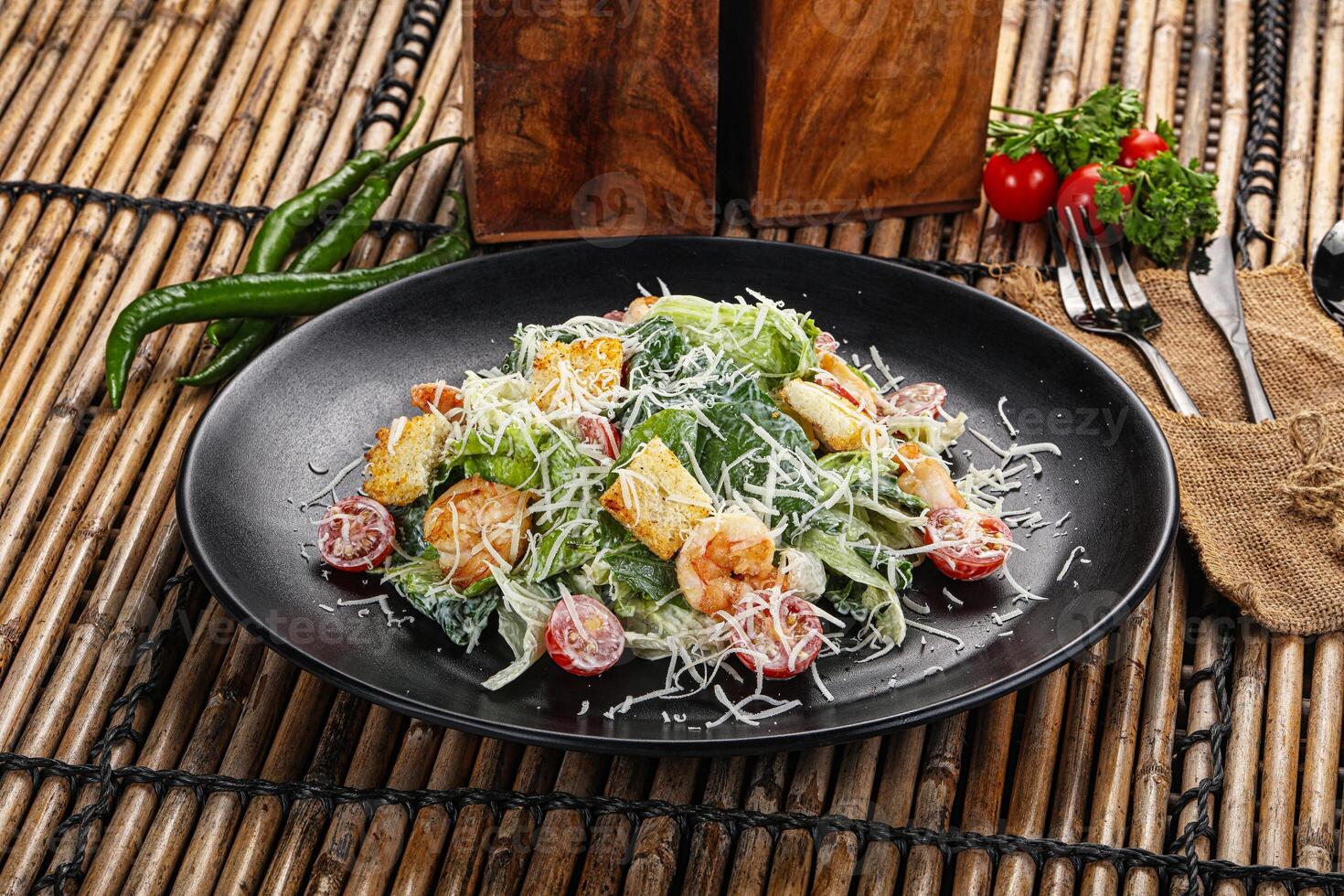 Tasty Caesar salad with prawn photo