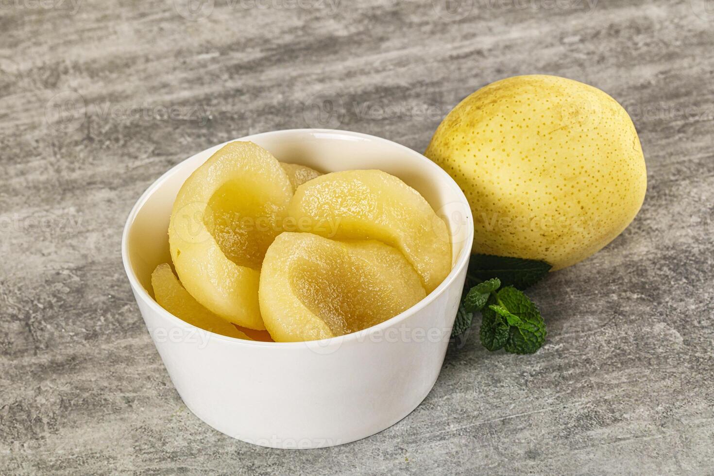 Canned yellow pear with syrup photo