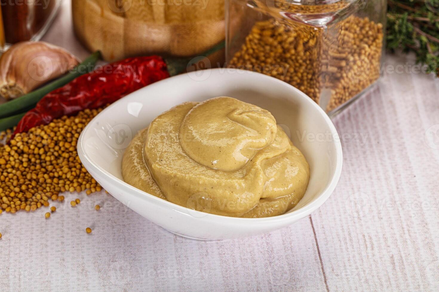 Dijon mustard sauce in the bowl photo