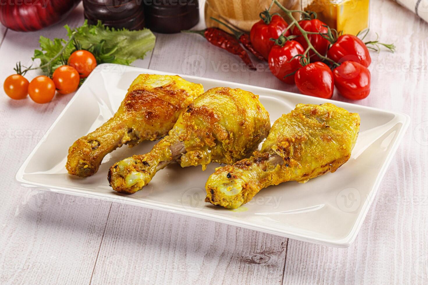 Roasted Chicken leg drumsticks with curry sauce photo