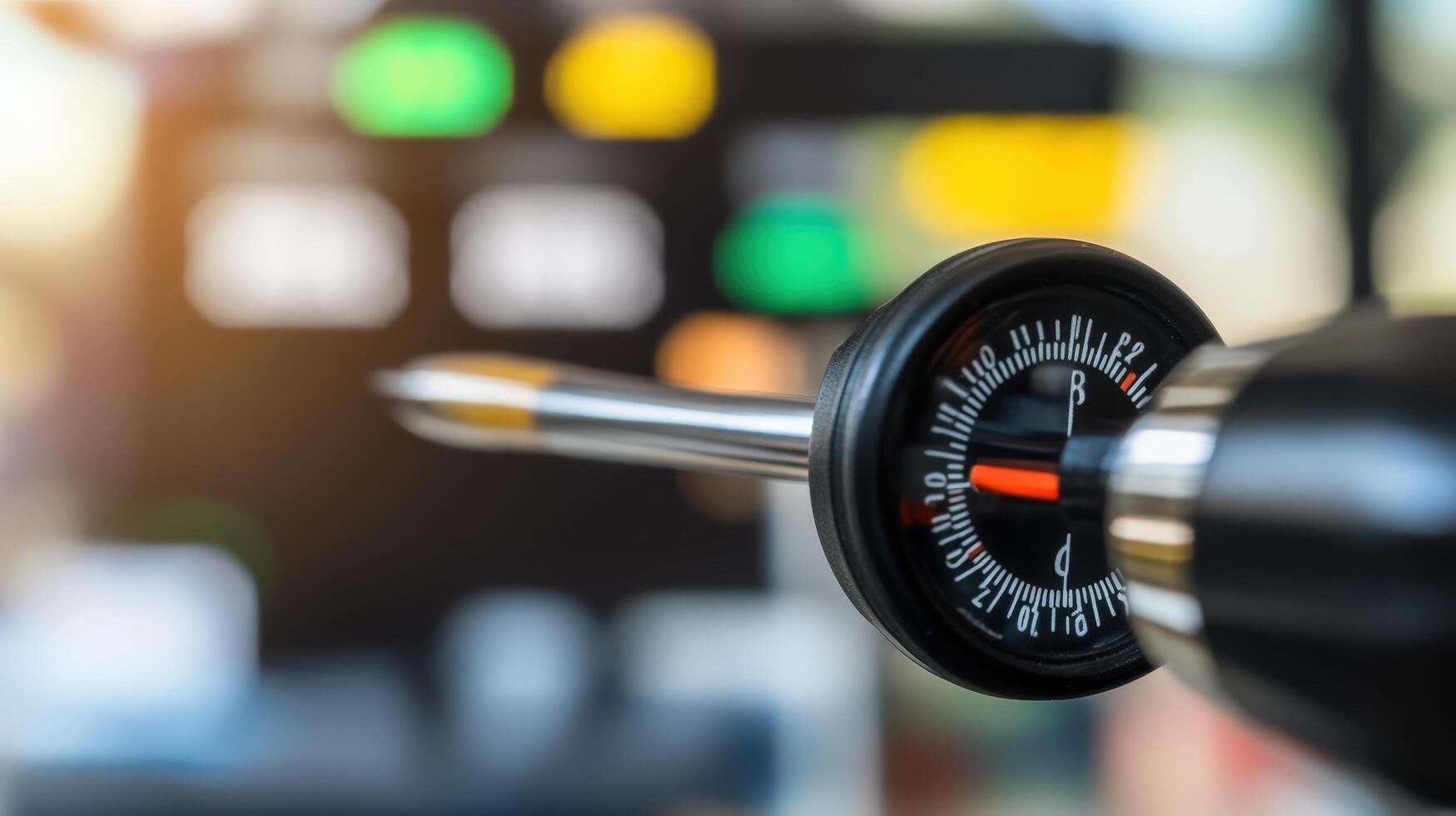 Precision Measurement Instrument with Dial and Pointer Against Blur Background photo