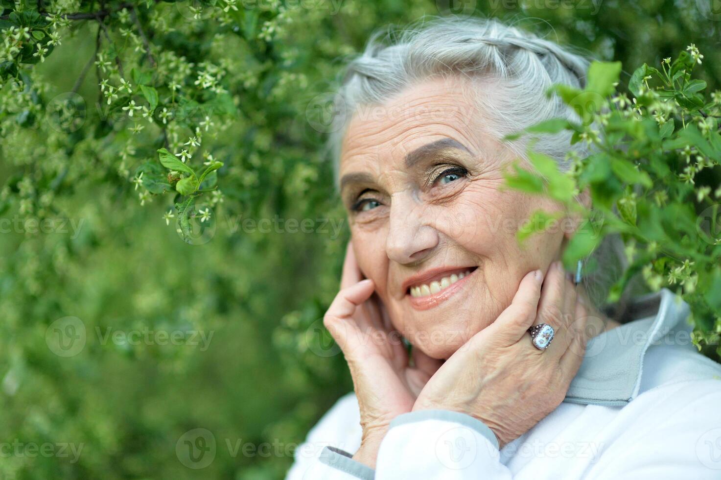 Portrait of a beautiful woman in the park in summer photo