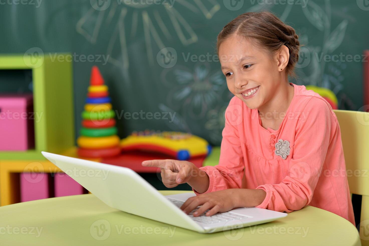 Portrait of girl studing with laptop at classroom photo
