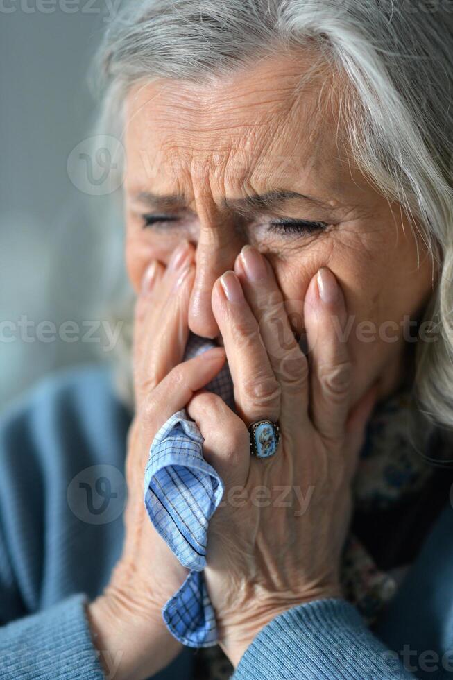 Close up portrait of a sick senior woman photo