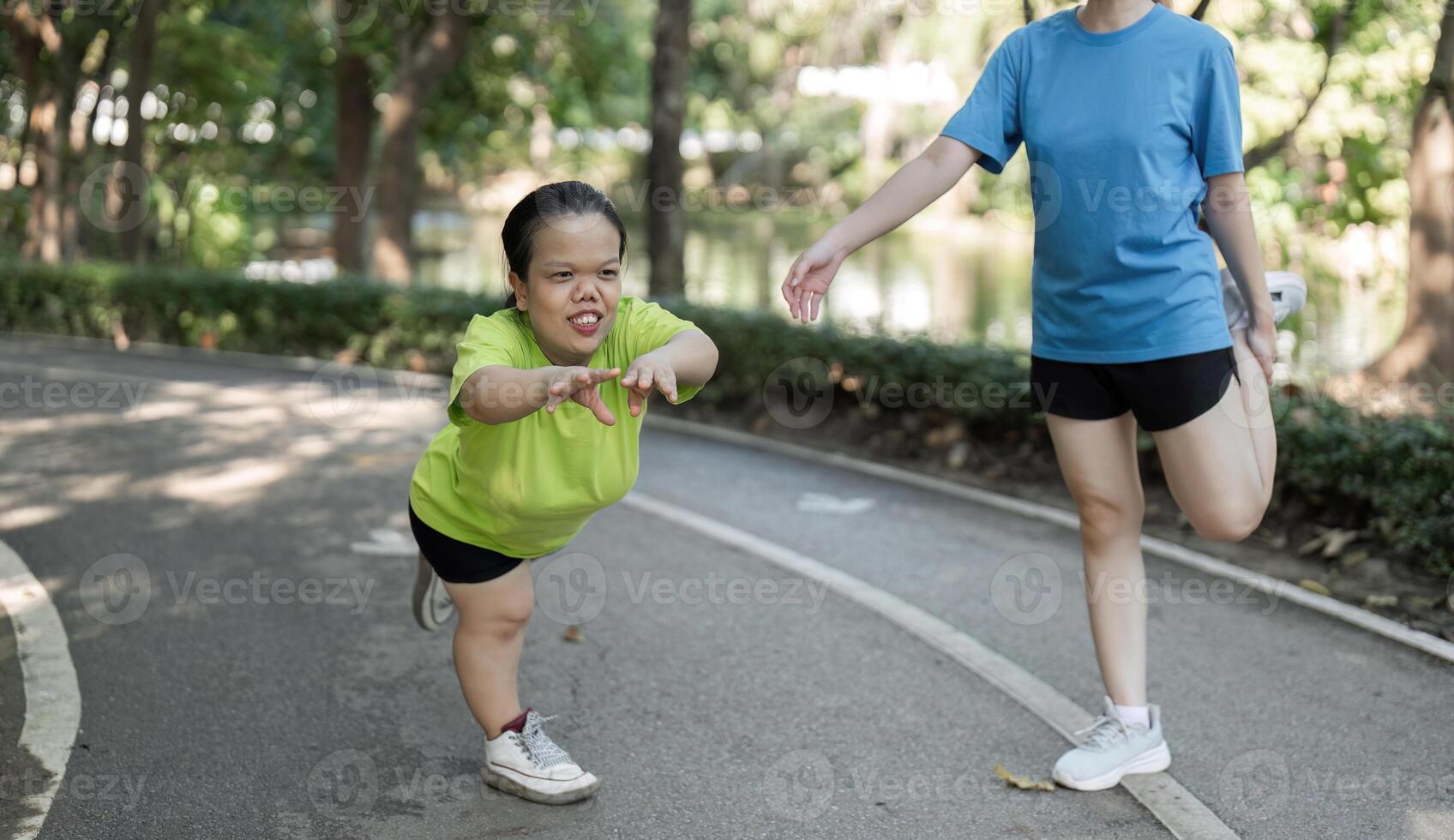 Petite Disabled Woman Exercising in Park with Friend, Embracing Fitness and Friendship in an Inclusive Outdoor Setting photo