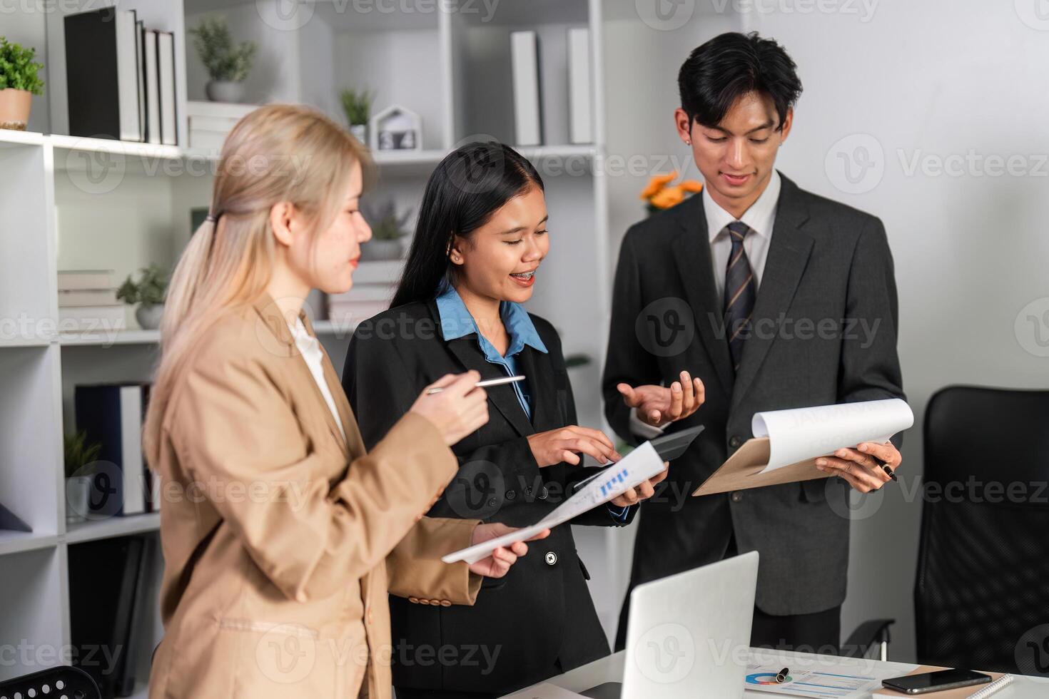 Diverse Business Team Collaborating on Project Strategies in Modern Office Environment photo