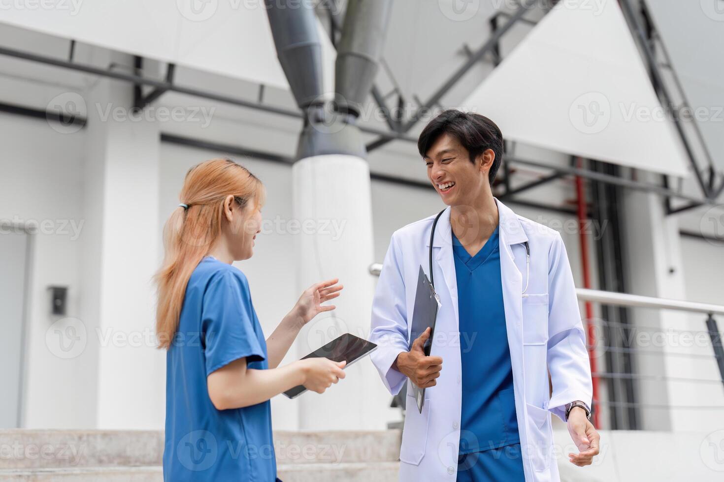Healthcare discussion between medical students university campus candid interaction bright environment close-up view collaboration concept photo
