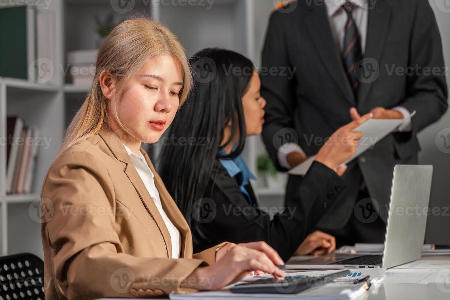 Business Team Collaborating on Strategic Work Plans in a Modern Office Environment photo