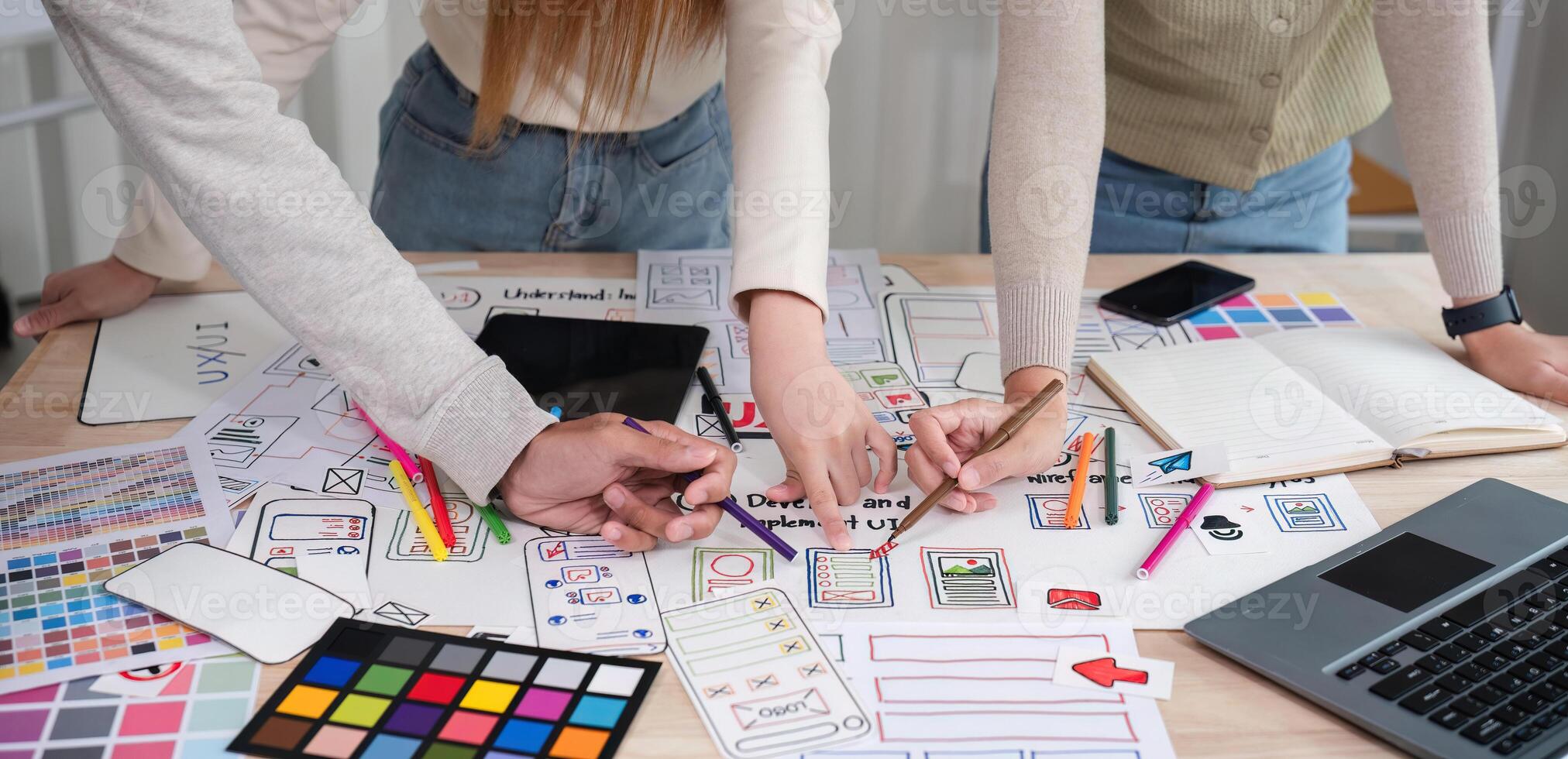 Brainstorming session for the creative team of designers in application design and implementation planning ux ui Teamwork of modern business teams photo