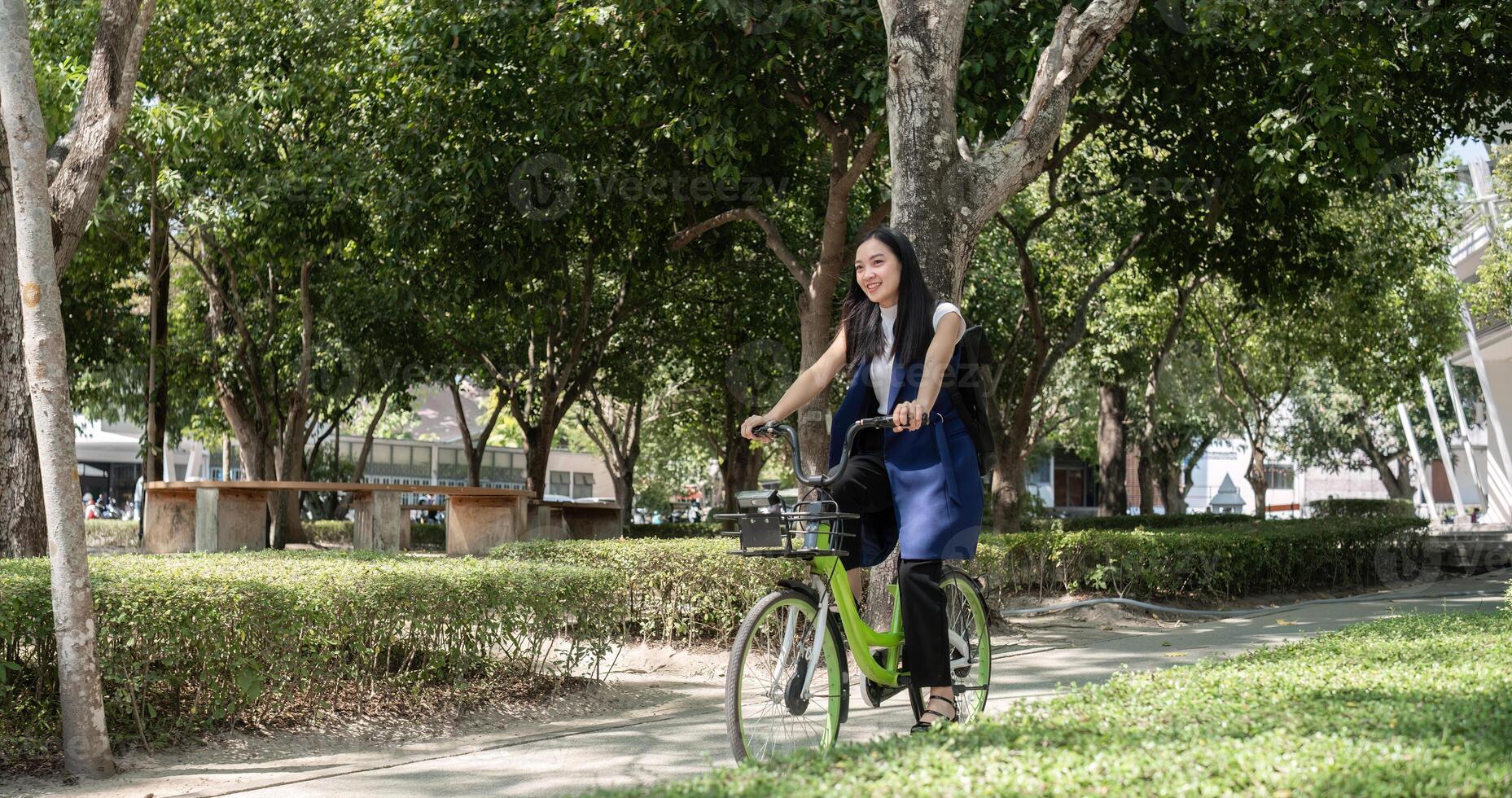 Business Woman Commuting by Bicycle in Urban Setting for Eco-Friendly and Healthy Lifestyle photo