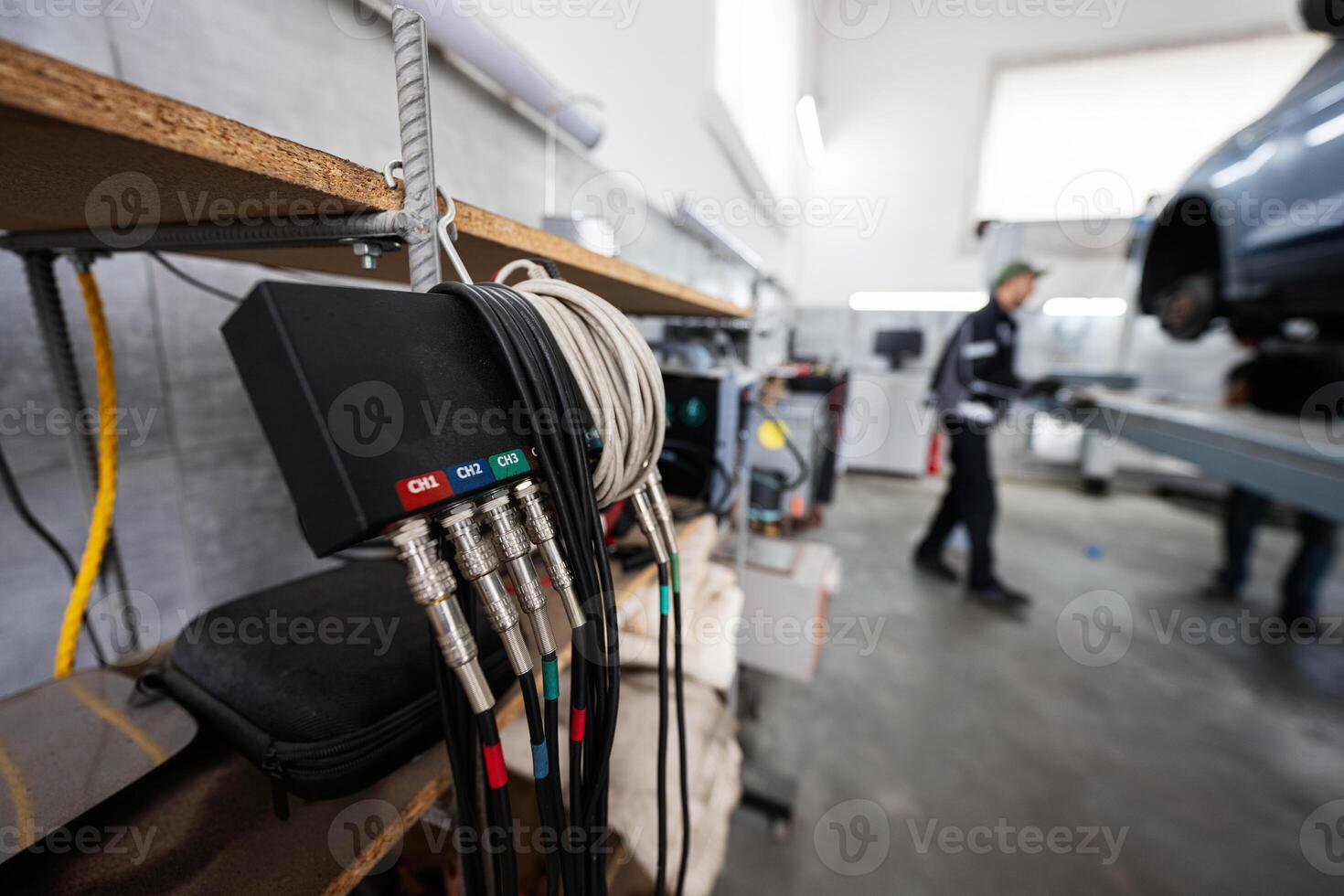 Close-up of automotive diagnostic tools in a modern garage photo