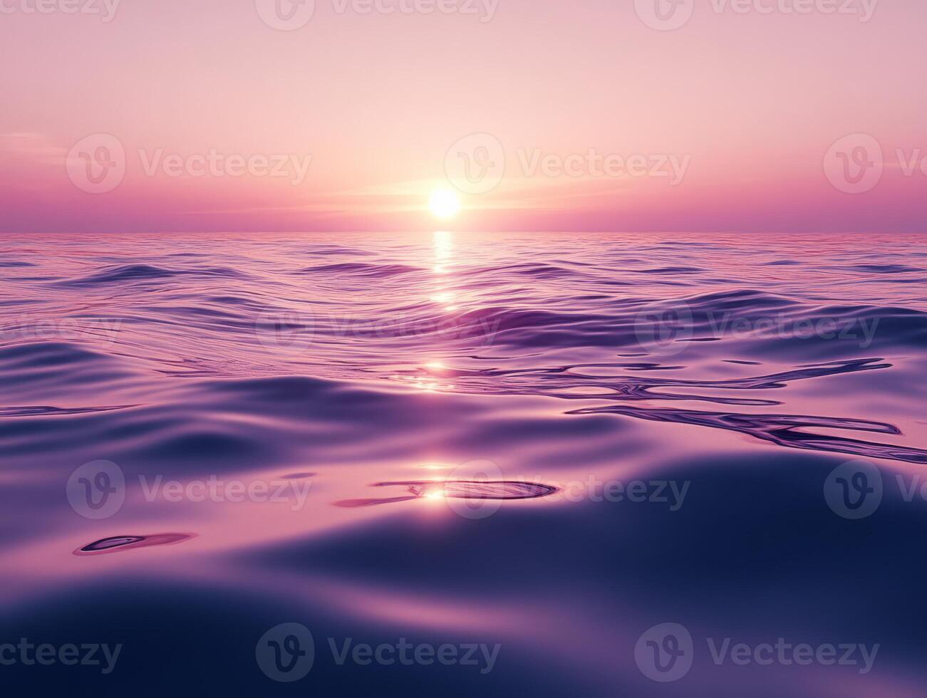 Vibrant purple sunrise reflecting on calm lake with gentle ripples photo