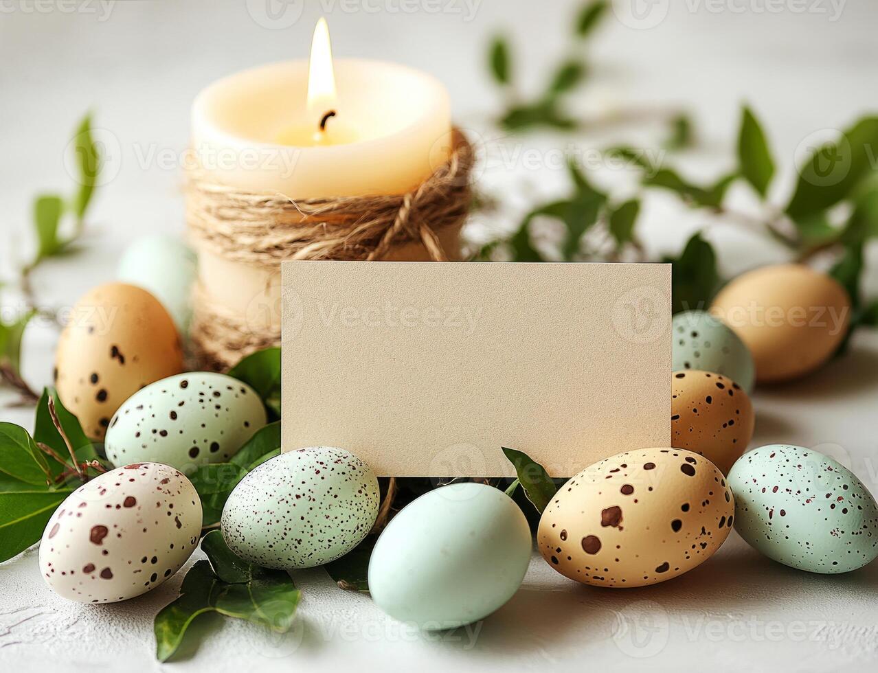 Easter eggs, candle and blank greeting card decorating a white photo