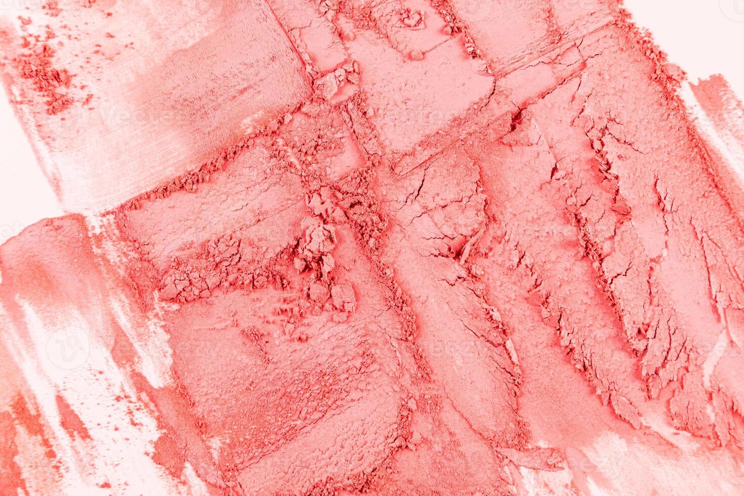 A chic example of a dry blush in a pink tone. chaotic strokes of blush. cosmetic texture. Abstract cosmetic background of decorative cosmetics. photo