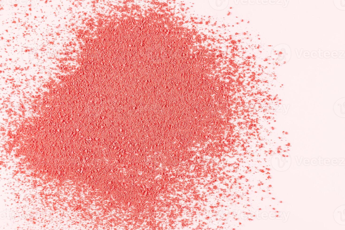 A loose sample of decorative pink blush on a white background. Dry blush texture. layout to advertise texture of the product. A copy space. top view. photo
