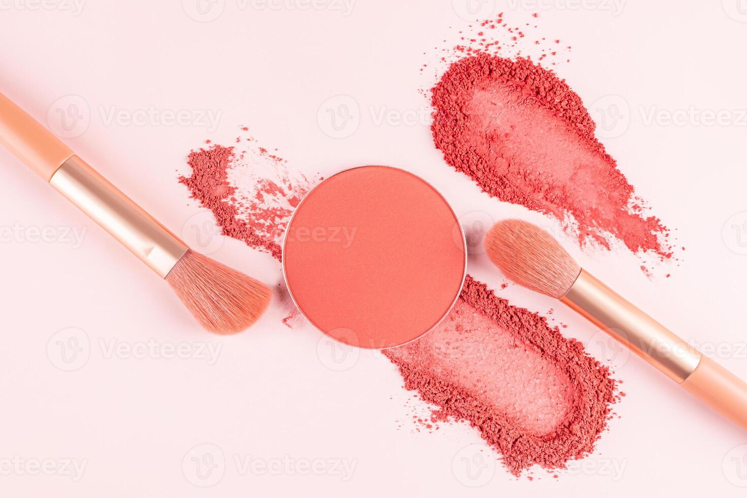 two strokes of pink dry blush, a round block refill pink blush, two makeup brushes on a light vertical background. Concept decorative cosmetics. photo
