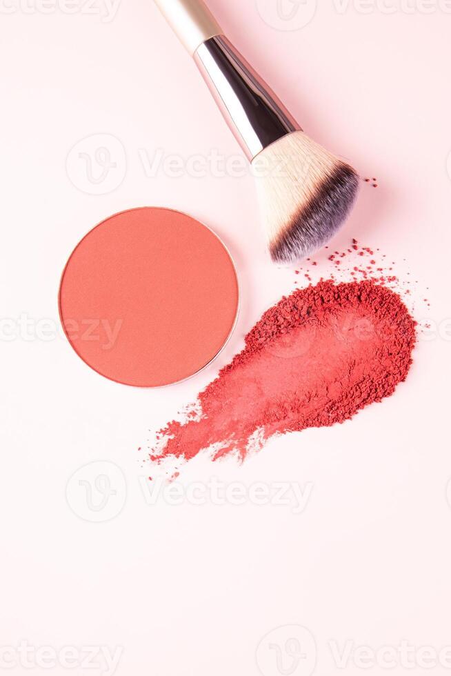 Round block refill pink blush, dry blush stroke, professional makeup brush on light background. vertical top view. A copy space. Decorative cosmetics photo