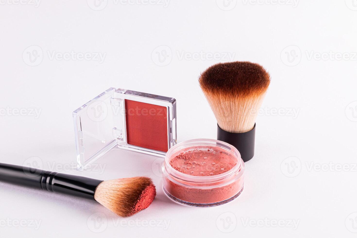 Two packs of different blush, professional brushes on a white background. concept of beauty, decorative cosmetics. advertising of a cosmetic product. photo