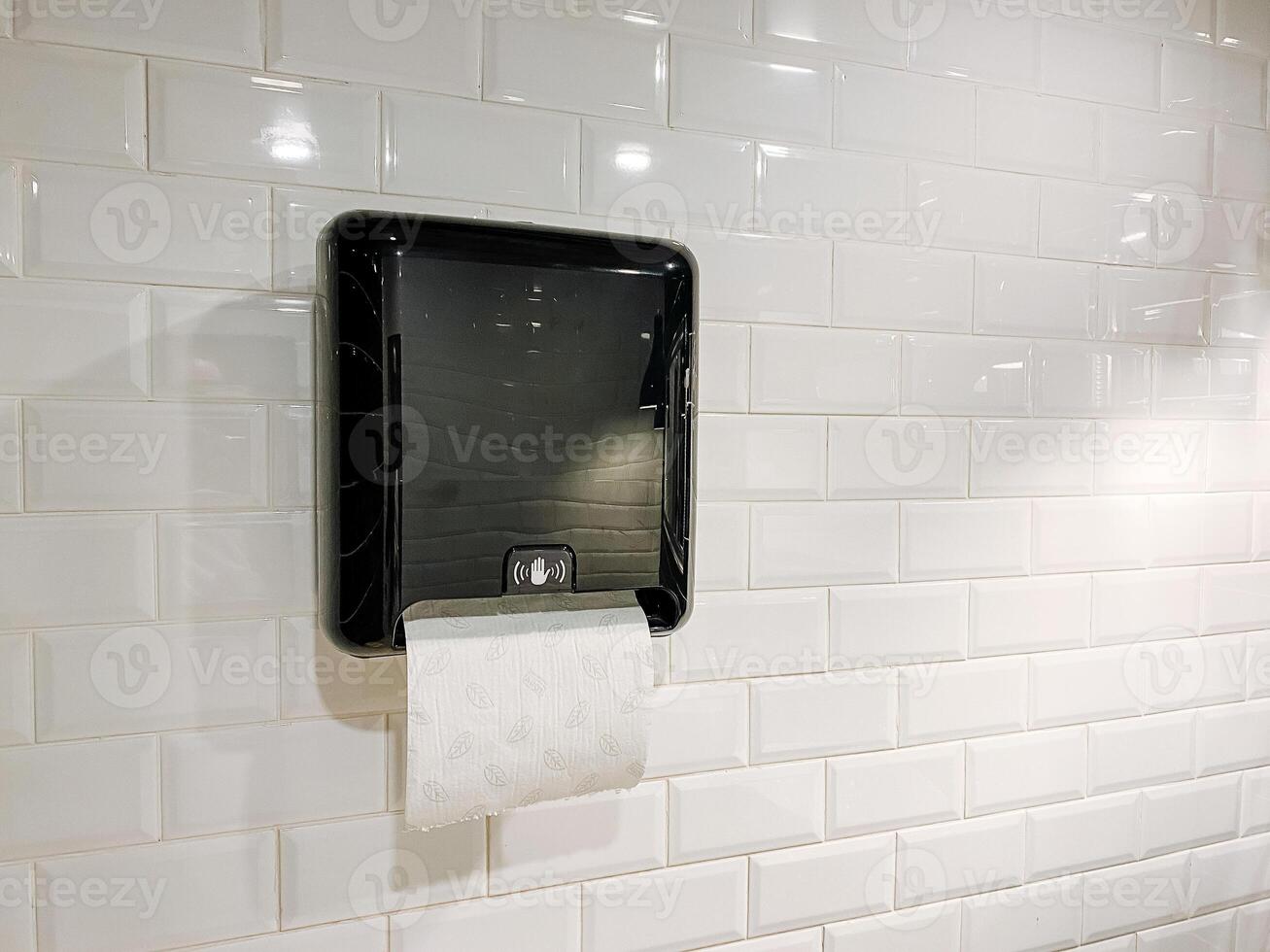 Rectangular black paper towel dispenser for wall in modern style photo